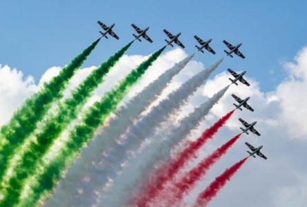 Aerobatic planes color the sky with the Italian tricolor.